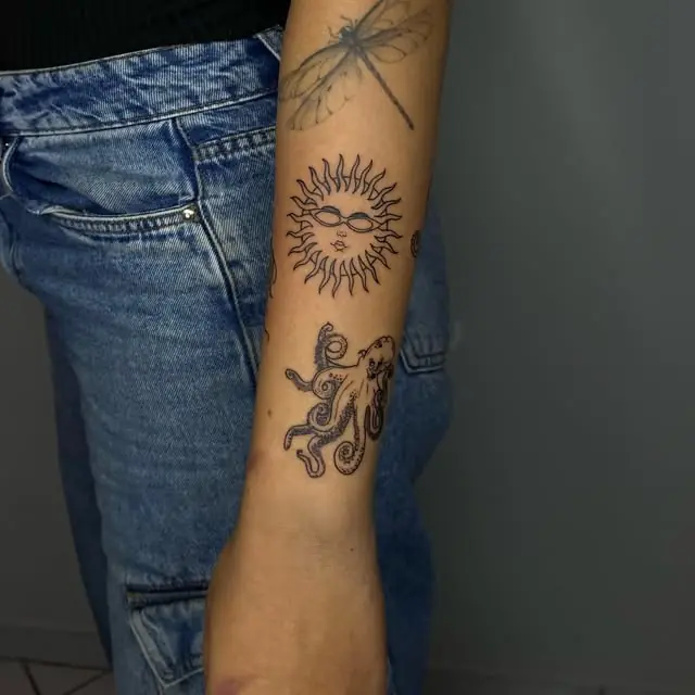 Sol com rosto no antebraço